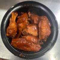  Wings (6 pcs) · Cooked wing of a chicken coated in sauce or seasoning.