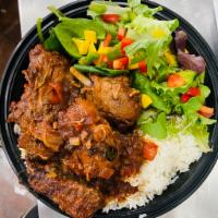 Brown Stew Chicken  · Marinated in spice and nicely stewed down with carrots and potatoes in brown gravy