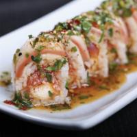 Spicy White Dragon Roll · Spicy tuna and shrimp tempura wrapped in soy paper, topped with seared yellowtail and spicy ...