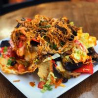 Nachos · Tortilla chips, Monterey jack cheese, lettuce, tomato, black olives, and jalapenos served wi...