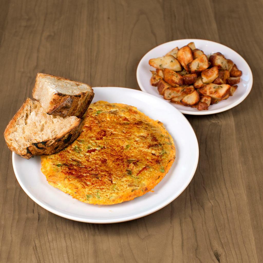 Spicy Sausage & Swiss Frittata · eggs, sausage, swiss, roasted red bell peppers, scallions, sriracha, paprika & served with artisan toast & home fries