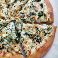 Spinach Alfredo Pizza · Spinach, mushrooms, bacon, Alfredo sauce and pizza cheese.