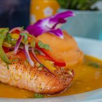 Pan Seared Mango Salmon · Pan-seared salmon topped with mango salsa and served with chipotle mash potatoes.