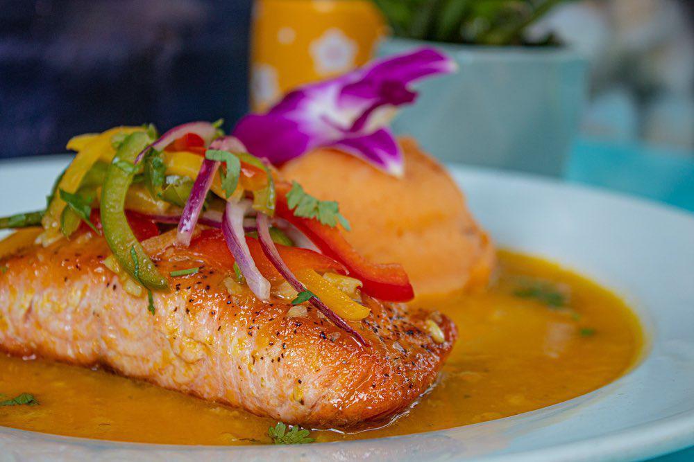 Pan Seared Mango Salmon · Pan-seared salmon topped with mango salsa and served with chipotle mash potatoes.