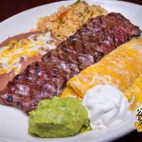 Tampiquena Grill · Grilled skirt steak served with rolled corn tortillas, filled with cheese and topped with sa...