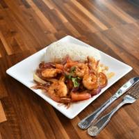 Camaron Saltado · Shrimps sauteed in onions, tomatoes, cilantro, french fries, and soy sauce served with jasmi...