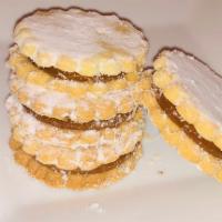 Alfajores · 3 shortbread cookies filled with dulce de leche and topped with powdered sugar.