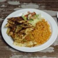 32. Fajita Quesadilla Regular · Choice of style. 2 quesadillas served with salad and rice. Grilled vegetables on request.