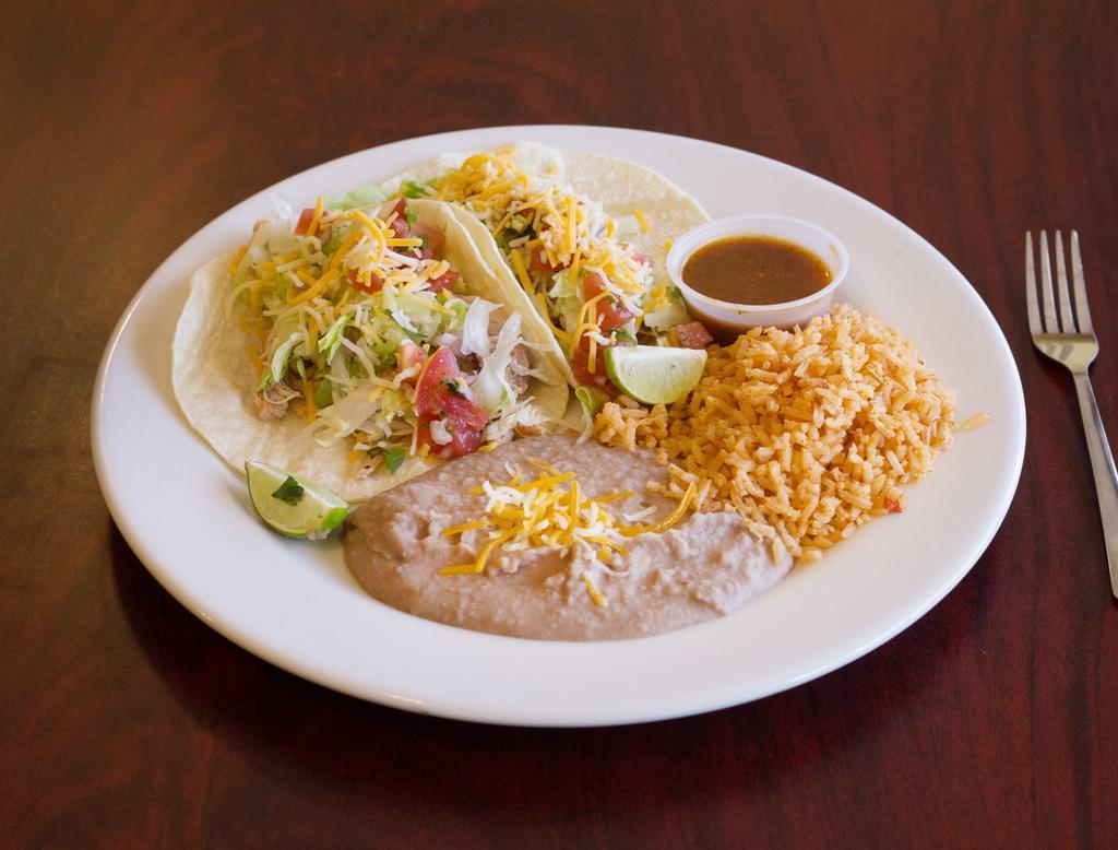 Chicken Fajita Tacos · 2 tacos with lettuce, pico de gallo and shredded cheese, with your choice of flour or corn tortillas, served with refried beans and rice.