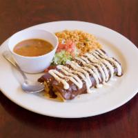 Mole Enchiladas · 2 corn tortillas stuffed with shredded chicken topped with mole, sesame seeds and sour cream...