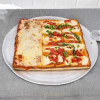 Margherita Sicilian Pie · Special sauce fresh mozzarella, mozzarella cheese, extra virgin olive oil and basil.