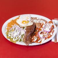 Breakfast Chilaquiles · Choice of red or green salsa, served with 2 eggs, queso fresco, cebolla y crema.