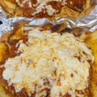 Chicken Parmesan · Breaded chicken breast topped with meat sauce, covered with melted Parmesan and mozzarella c...
