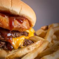 Rodeo Signature Burger · 2-patty delight topped with cheddar cheese, our signature crispy onion rings and a BBQ sauce...