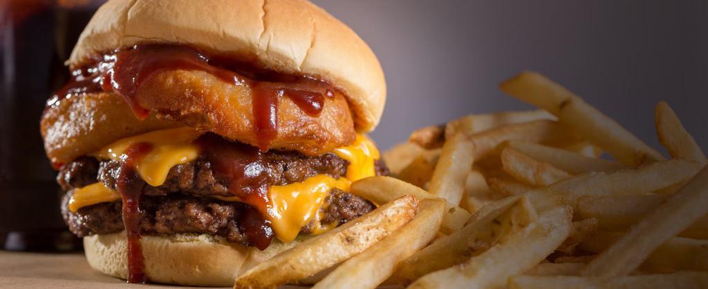 Rodeo Signature Burger · 2-patty delight topped with cheddar cheese, our signature crispy onion rings and a BBQ sauce tangy enough to kick anyone off their mechanical bull.