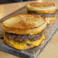 Cheeeesy Burger · 4 slices of melted American cheese and 2 beef patties cooked-to-order sandwiched between an ...