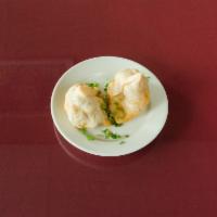 2 Pieces Vegetable Samosa · Golden brown fried pastries with stuffing of potato, green peas, paneer cottage cheese, rais...