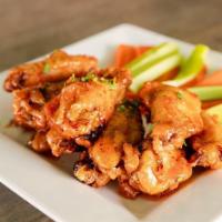 Buffalo Wings · Served plain or tossed in one of our sauces: Buffalo hot sauce, pineapple cinnamon sauce, sw...