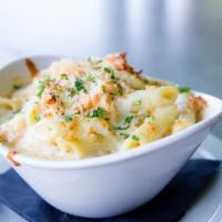 Lobster Mac and Cheese · Penne pasta mixed with three cheeses, lobster and a brandy cream sauce baked to perfection.