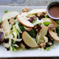 Apple Walnut Salad · Crisp apples, glazed walnuts, dried cranberries and shaved parmesan cheese on a bed of mixed...