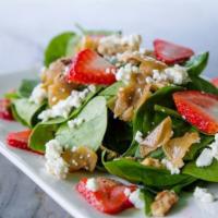 Spinach Salad · Fresh spinach, caramelized onions, candied walnuts, goat cheese, seasonal berries mixed with...