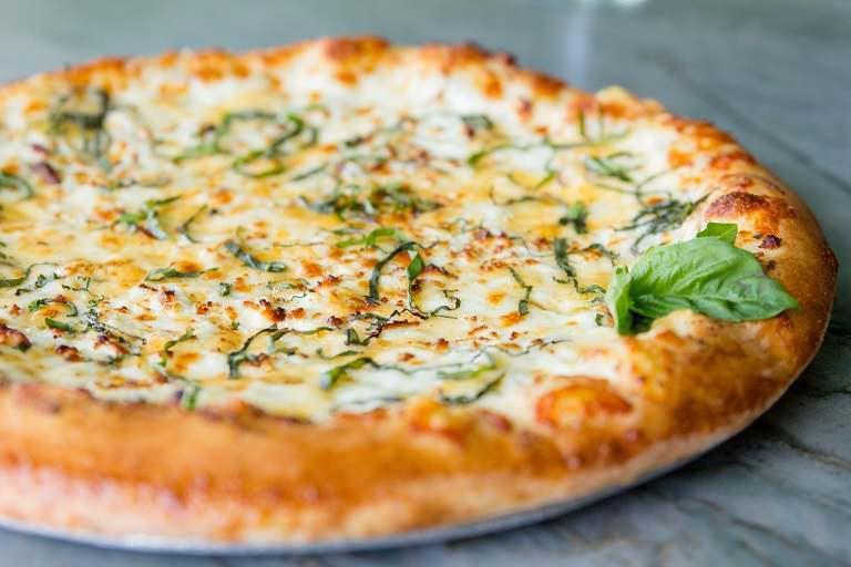 Five Cheese Pizza · Gouda, feta, mozzarella, Parmesan and ricotta cheeses, fresh garlic and basil, with roasted garlic oil.