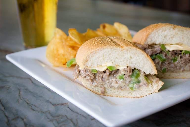 Philly Cheese Steak Sub Sandwich · Thinly sliced steak sauteed with onions and bell peppers topped with provolone cheese.