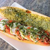 Caprese Sub Sandwich · Fresh tomatoes and fresh mozzarella cheese,  pesto sauce, layered and topped with fresh basi...