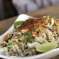 CLASSIC CHICKEN SALAD  -  GỎI GÀ XÉ (GF) · Pulled chicken breast, shredded cabbage, onions, fresh herbs, tossed in house vinaigrette, t...