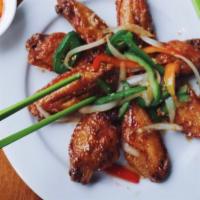 Caramelized Chili & Fish Sauce Wing (1LB) -  Canh Ga Chien Nuoc Mam.  · glazed and tossed in caramelized fish sauce, palm sugar, butter, garlic, onions, bell peppers