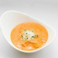 Coconut Chicken Curry · Boneless chicken in curry sauce with mustard seeds and coconut.