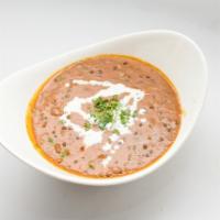 Daal Makhni · Lentils sauteed in butter with fresh herbs and spices, garnished with fresh coriander.
