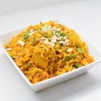 Chicken Biryani · Basmati rice cooked with chunks of chicken, nuts, and spices.
