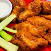 Pub Wings · 8 crispy breaded wings tossed in your choice of garlic Parmesan, Buffalo, BBQ, or kaboom sau...