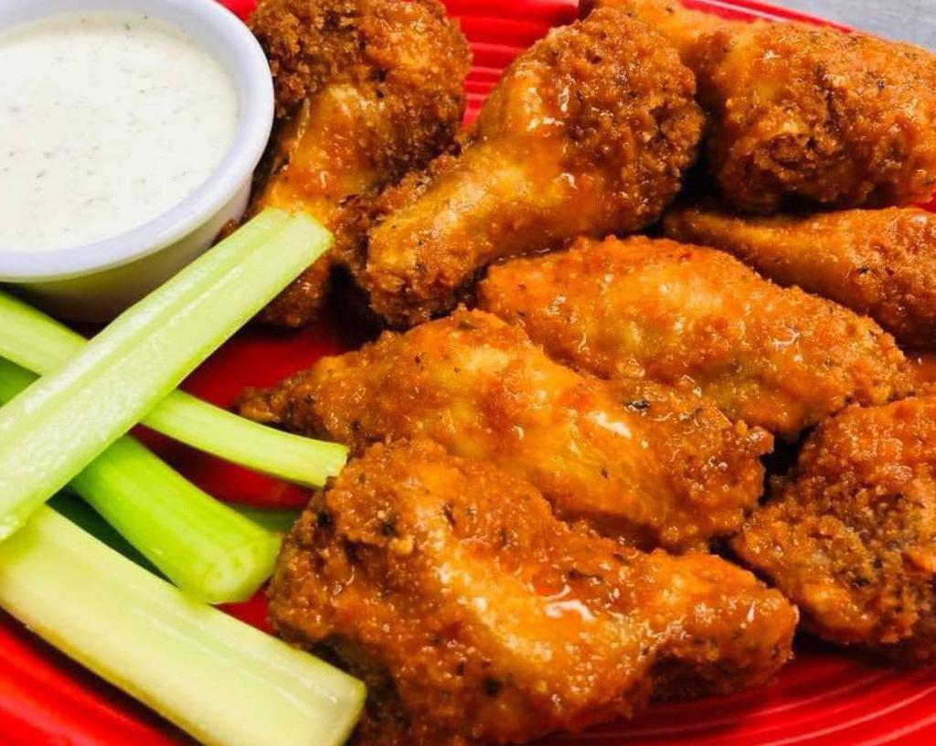 Pub Wings · 8 crispy breaded wings tossed in your choice of garlic Parmesan, Buffalo, BBQ, or kaboom sauce.