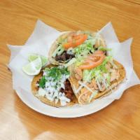 Al Pastor Taco · Seasoned pork. Served with a side of rice and beans.