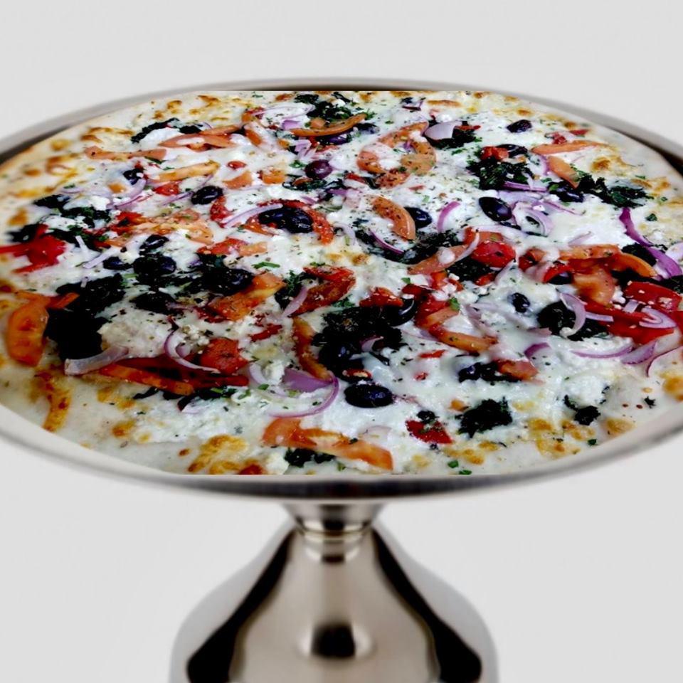 Amalfitano Pizza · Red onion, tomato, Kalamata olives, fresh spinach, roasted red peppers, feta, ricotta cheese, and no pizza sauce.