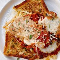 Chicken Parmesan · Hand breaded, fettuccine, mozzarella cheese, marinara sauce, garlic toast and side salad.