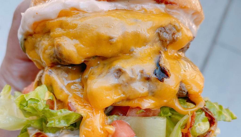 All American Burger · american cheese, shredded lettuce, tomato, thousand island dressing, served with hand-cut fries