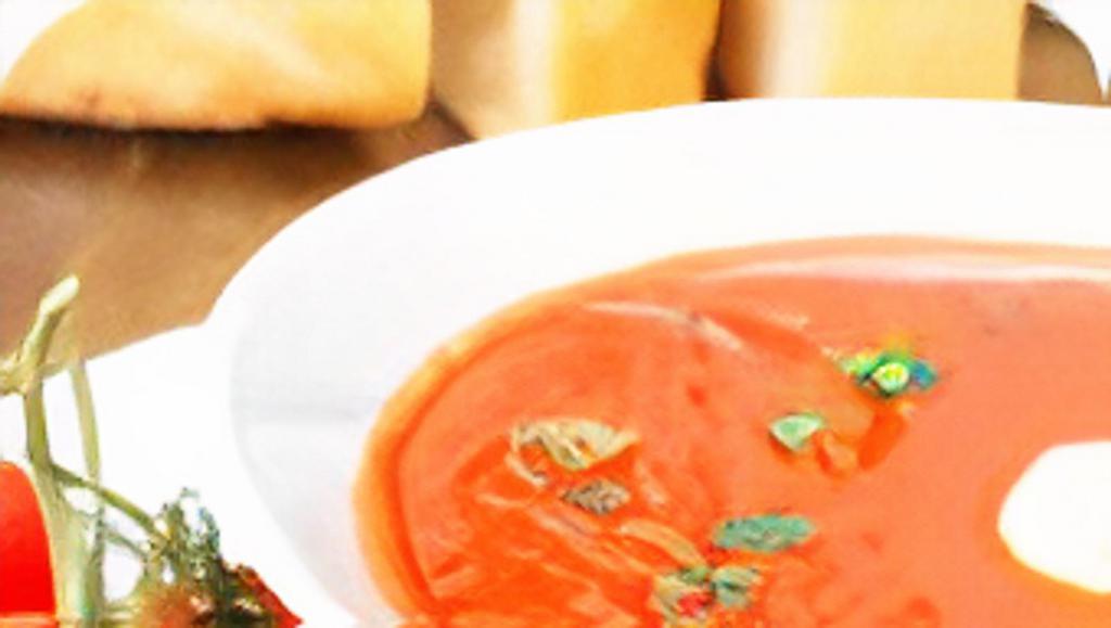 Tomato Soup · Tomatoes blended with cream, pepper, and served with fried bread..