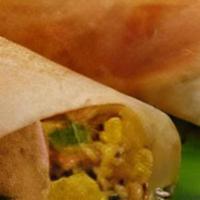 MAA Spicy Masala Dosa · Rice crepe with maa special spicy chutney and stuffed with vegetable masala.