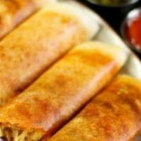 Spring Masala Dosa · Spiced crepe filled with onion, cabbage, carrot, and green onion.