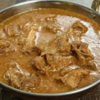 Goat Korma · Goat cooked in South Indian style coconut sauce.