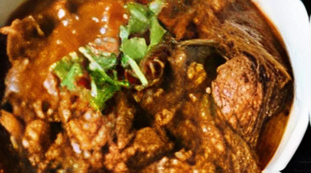Goat Vindaloo · Goat cooked with potatoes in fiery red hot curry sauce.
