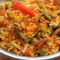 Vegetable Dum Biryani · Basmati rice cooked with Indian herbs vegetables.
