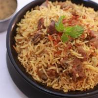 Ulavacharu Lamb Biryani · Basmati rice cooked with layers of lamb and ulavacharu in the Hyderabadi dum style.