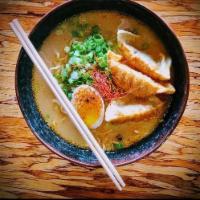 Gyoza Ramen · Ramen noodles, tonkotsu pork broth, 3 crispy pork dumplings, egg, green onion.






