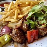 Bo Luc Lac French Fries (Filet mignon) · Shaking filet mignon beef cubes with fries.
