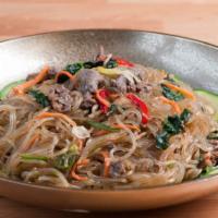 K8. Japchae · Stir fried glass noodles with beef and vegetables.