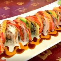 Asian Pot Roll · Salmon with tuna and cream cheese inside, crab meat, and avocado on the top with sauce.
